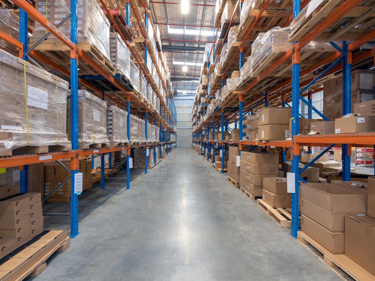 A warehouse aisle with racked pallets