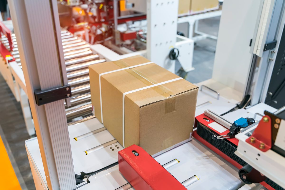 Strapped cartons moving on a conveyor